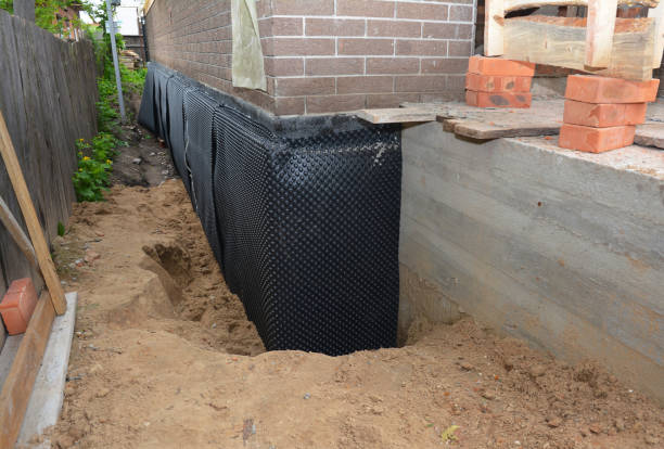 Happy homeowners after waterproofing job in Morristown